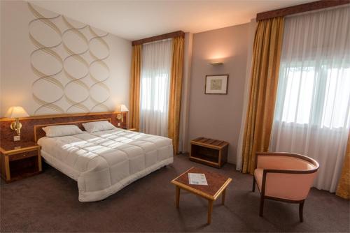 Postel nebo postele na pokoji v ubytování Le Manoir