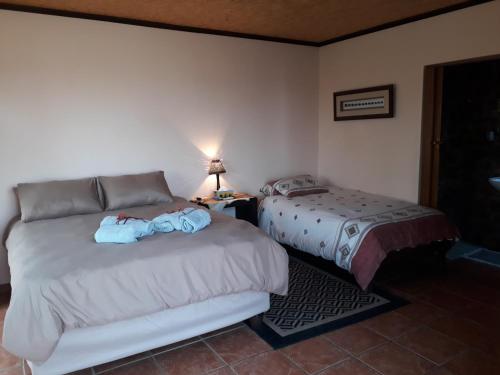 Ένα ή περισσότερα κρεβάτια σε δωμάτιο στο Onduri Lodge