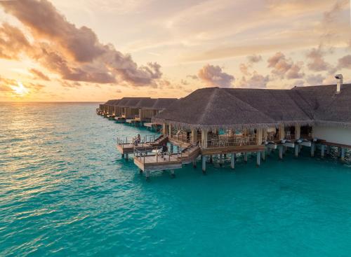 a resort on the water in the middle of the ocean at Baglioni Resort Maldives - Luxury All Inclusive in Dhaalu Atoll