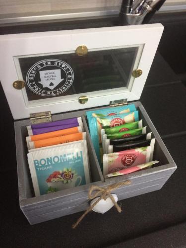 a drawer filled with books and other books at Casa Violet per Civita in Bagnoregio