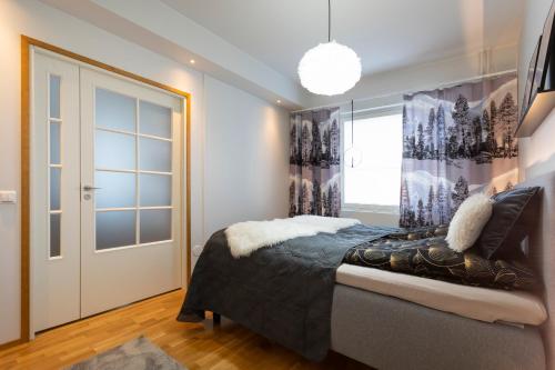 Ένα ή περισσότερα κρεβάτια σε δωμάτιο στο Vasko luxurious suites, Kaakkuri