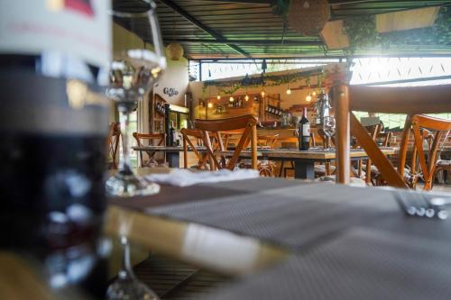 a dining room with tables and chairs and a restaurant at Finca Hotel Yerbabuena in Pereira