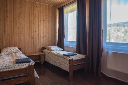 Katil atau katil-katil dalam bilik di Старе Подвір'я