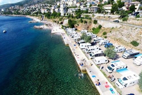 an aerial view of a parking lot next to the water at Apartments Valiža in Senj