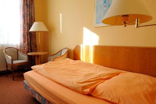 Postel nebo postele na pokoji v ubytování Wellness Penzion Kroměříž - Zlobice