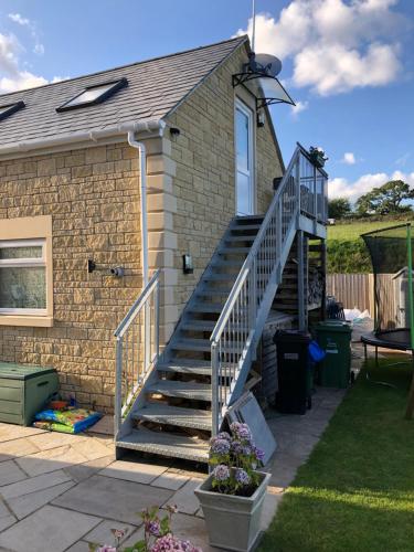 a house with a staircase leading up to a house at The Annexe rural retreat near Bath in Bath