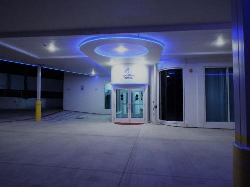 an empty room with a blue light in a building at Athens Central Hotel in Athens