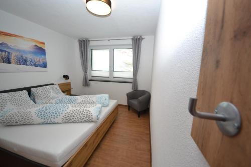 Postel nebo postele na pokoji v ubytování Alpenapart Gastl
