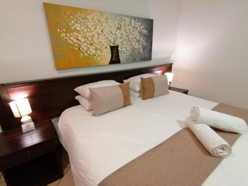 Ένα ή περισσότερα κρεβάτια σε δωμάτιο στο Fourways BnB