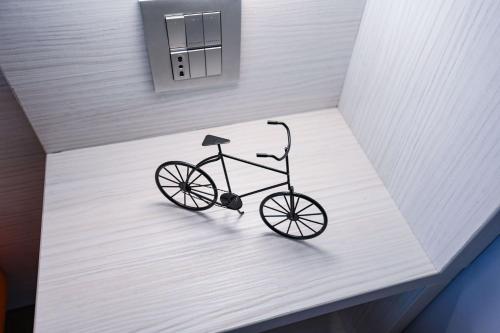 a bike sitting on a table in a room at Hotel La Fiorita in Limone sul Garda