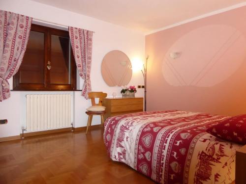 Ένα ή περισσότερα κρεβάτια σε δωμάτιο στο Appartamento Panorama Bormio