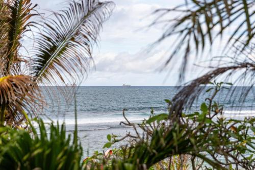 a view of the beach with a boat in the ocean at Villa Bella in Mahe