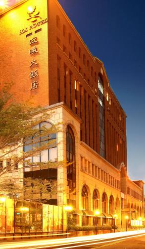 a large brick building with a sign on the side of it at SOL Hotel in Hsinchu City