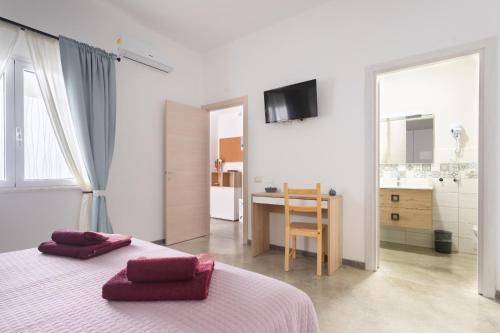 Postel nebo postele na pokoji v ubytování 40° Parallelo Guest House
