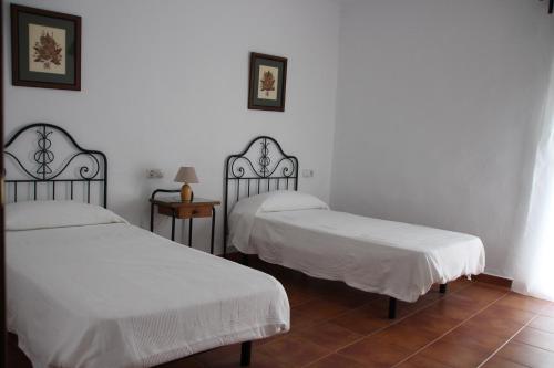 CASA RURAL EL ARRIERO tesisinde bir odada yatak veya yataklar