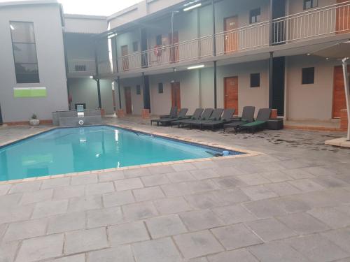 a swimming pool in the middle of a building at Green Side accommodation in Rustenburg