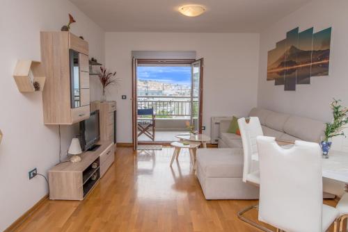 a living room with a couch and a tv at Apartment Stefano in Bar