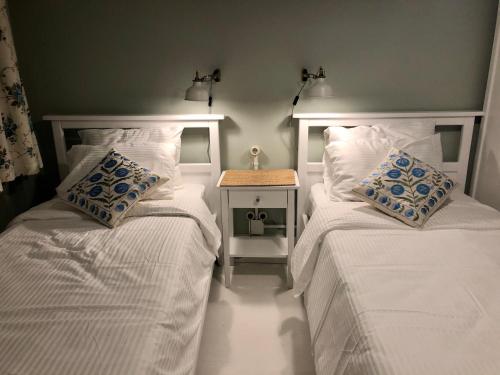 two beds sitting next to each other in a bedroom at Mehmet Bey Suites in Istanbul