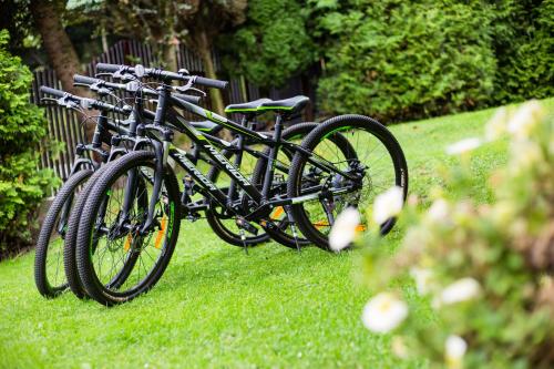 a couple of bikes parked in the grass at RowerowyFun in Nowy Sącz