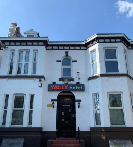 a white building with a sign that reads valley hotel at Manchester Stay Hotel - Free Parking in Manchester