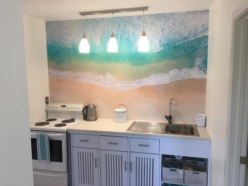 a kitchen with a sink and a counter top at Studio 531 in Coromandel Town