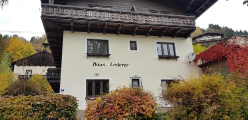 a white building with the words hos leader on it at Apartment Edelweiss in Zell am See