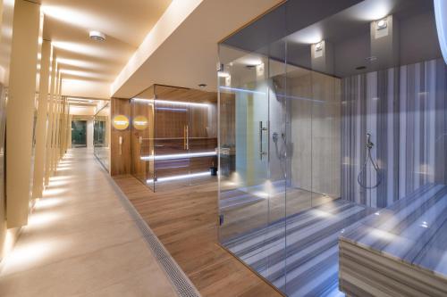 a bathroom with a glass wall at Hotel Cristal Białystok in Białystok