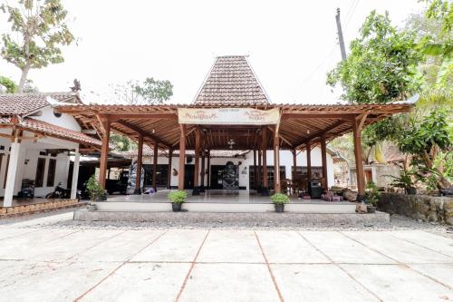 a pavilion in a courtyard of a house at Griya Erlangga Homestay in Yogyakarta