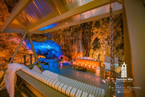 a room in a cave with a bed in it at Damma Mia in Damouchari