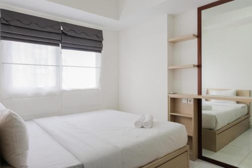 Postel nebo postele na pokoji v ubytování Elegant 1BR Apartment at Casa De Parco near AEON Mall By Travelio