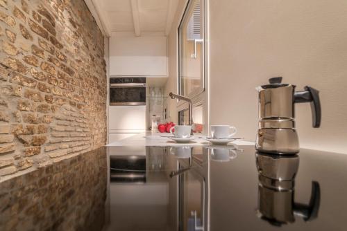 a kitchen with a coffee machine sitting on a counter at Campo De' Fiori Apartment - Charme Homes in Rome