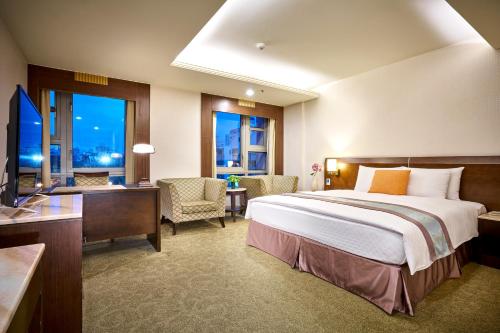 Ένα ή περισσότερα κρεβάτια σε δωμάτιο στο Zhong Ke Hotel