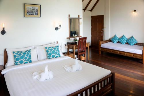 Ένα ή περισσότερα κρεβάτια σε δωμάτιο στο The Lodge