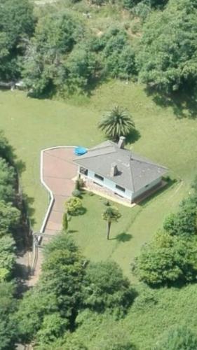 an aerial view of a house in a field at Vivienda Vacacional La Seronda in Ribadesella