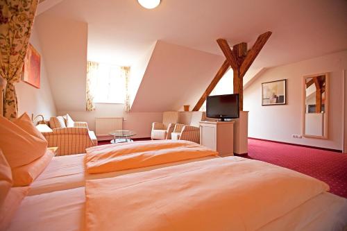 מיטה או מיטות בחדר ב-Drexel´s Parkhotel