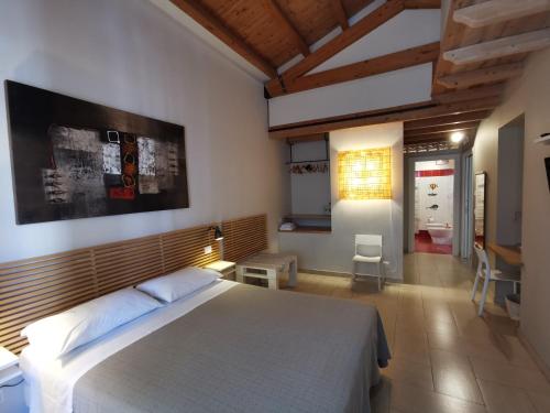 a bedroom with a large bed in a room at B&B Re Umberto in Milazzo
