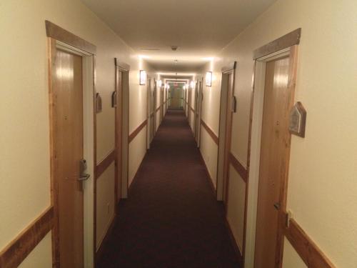a long corridor with doors and a long hallway at Reid Ridge Lodge in Blue Ridge