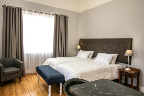 Postel nebo postele na pokoji v ubytování Victorian Square Guesthouse