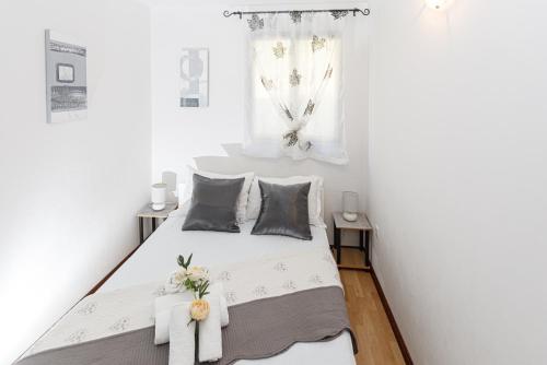 Ένα ή περισσότερα κρεβάτια σε δωμάτιο στο Apartments Cvita