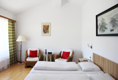 Postel nebo postele na pokoji v ubytování Hotel Alpenkrone