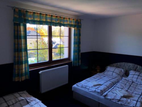 Postel nebo postele na pokoji v ubytování Apartmány Drexler