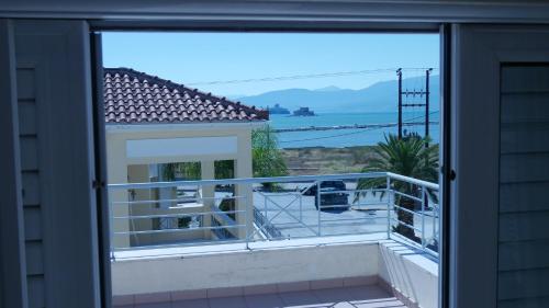 a view from the balcony of a house at Villa with the view of Palamidi and Bourtzi in Nafplio