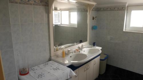 a bathroom with a sink and a mirror at Villa with the view of Palamidi and Bourtzi in Nafplio