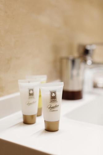 two cups sitting on top of a counter at Familion ApartHotel in Chişinău
