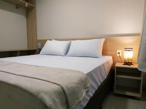 Ένα ή περισσότερα κρεβάτια σε δωμάτιο στο Pousada Montanhas do Caparaó