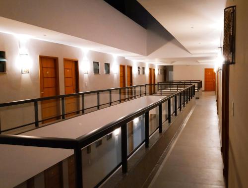 a hallway of a building with a long corridor at Pousada Montanhas do Caparaó in Alto Caparao