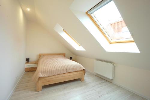 Postel nebo postele na pokoji v ubytování Viking Home: Apartament Joanna