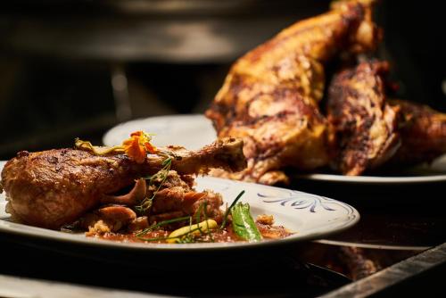 a plate of food with a piece of meat on it at Fredrick's Hotel Restaurant Spa in Maidenhead