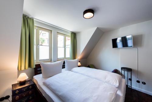 Katil atau katil-katil dalam bilik di Zum fröhlichen Tagelöhner