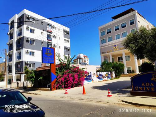 a street with a building and some orange cones at RiX Studio Park Famagusta Contactless Check In & Check Out in Mağusa